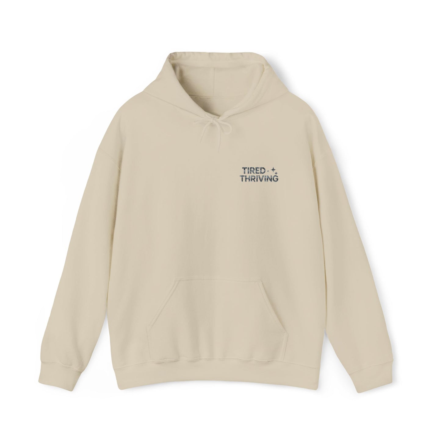 Minimal “Tired + Thriving” Embodied hoodie. Cozy fleece, unisex fit, durable chest graphic—everyday streetwear for busy days that still thrive.
