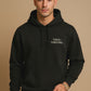 Minimal “Tired + Thriving” Embodied hoodie. Cozy fleece, unisex fit, durable chest graphic—everyday streetwear for busy days that still thrive.